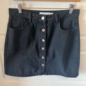Black denim mini skirt. Size 6.